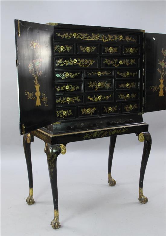 A late 17th century Chinese black lacquer cabinet, overall H. 5ft 3in.